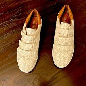 Michael Kors tennis shoes size 10M and Michael Kors sandals size 11M.